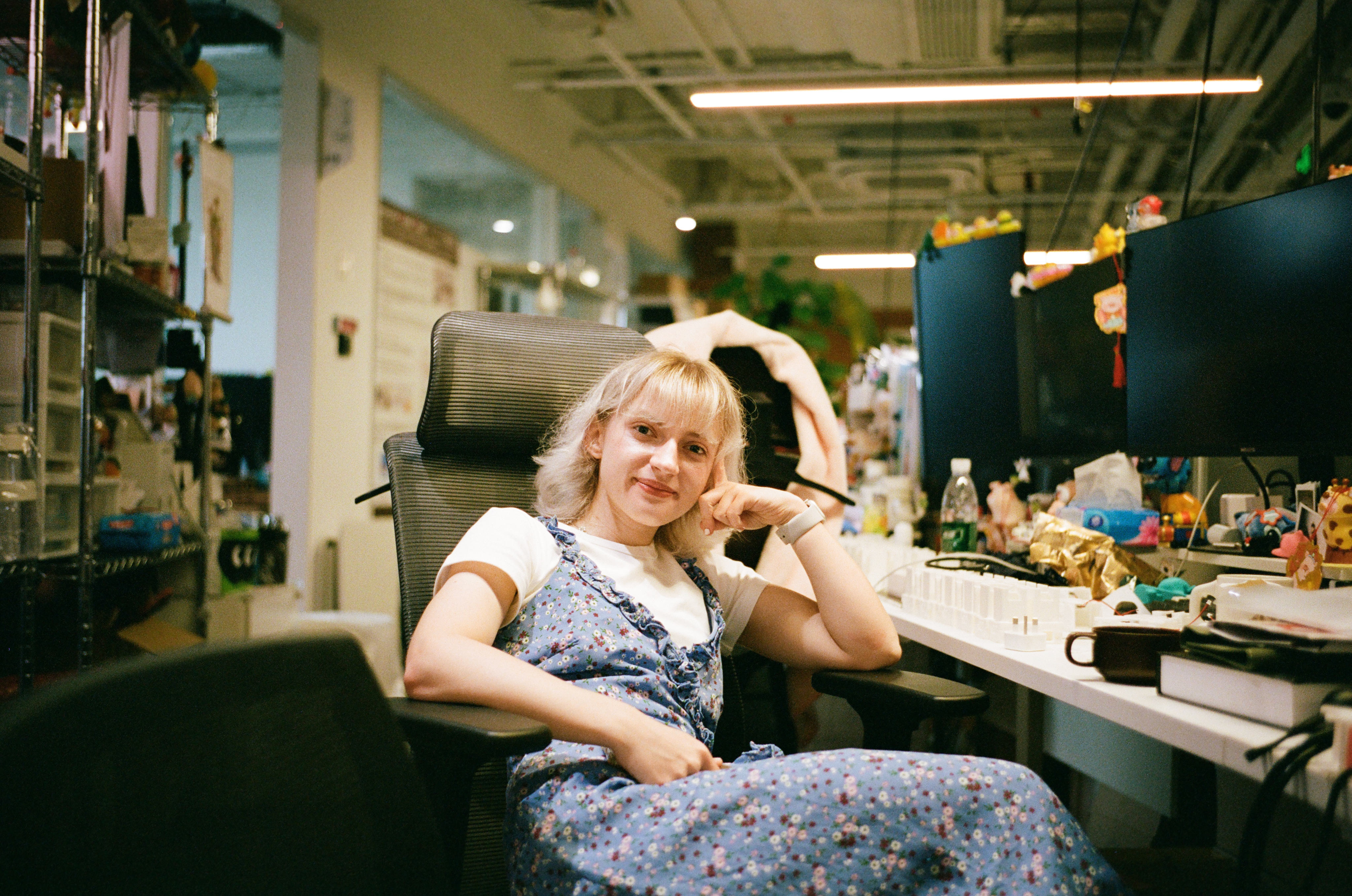 Anna seated in a design research studio
